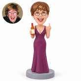 custom bobblehead figure female in a long gown holding a bottle and making a middle-finger gesture