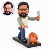 custom bobblehead figure man reaching forward with a cleaver beside a cartoon turkey