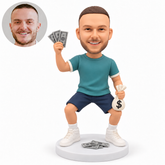 custom bobblehead figure male celebrating with raised banknotes and a money bag in a bent-knee stance