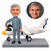 custom bobblehead figure male military pilot holding a helmet in front of an airplane