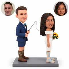 custom bobblehead figures wedding couple with the groom holding a fishing rod behind the bride