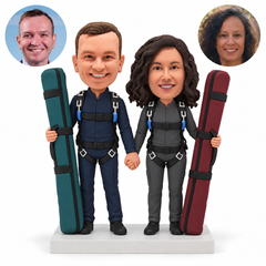 custom bobblehead figures skydiving couple holding two tall ski bags