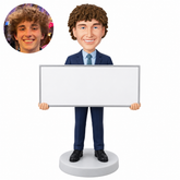 custom bobblehead figure businessman holding a large presentation board in front