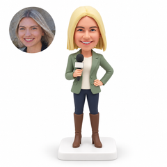 custom bobblehead figure female reporter holding a microphone with one hand on her hip
