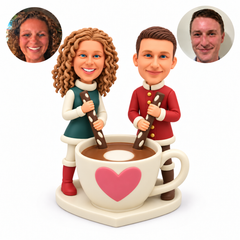 custom bobblehead figures couple stirring a giant cup of coffee with two sticks