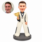 custom bobblehead figure male hockey goalie holding a trophy and wearing a medal