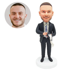custom bobblehead figure salesman holding a point of sale machine