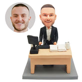 personalised bobble head figurine boss male colleagure sitting at a desk