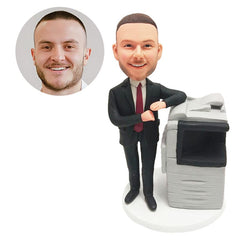 personalised bobblehead figure male colleague beside a large printer