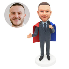 personalized bobblehead figurine businessman wearing a cape holding a dumbbell
