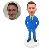 custom bobblehead figure business man in light blue suit with hands in pockets