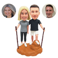 customized bobbleheads figures hiking couple holding walking sticks