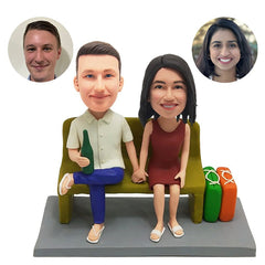 customized bobbleheads figures happy couple holding hands with suitcases beside
