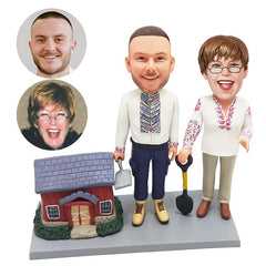 personalized gardener couple bobbleheads beside a house