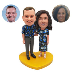 personalised bobble heads figures couple with arms around each other in floral Hawaii clothes