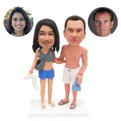 personalised bobble heads figures swimming couple holding towels with arms around each other