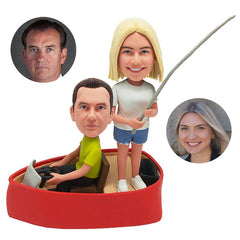 custom bobbleheads figures couple holding a fishing rod on a boat