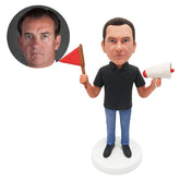 customised bobblehead figure guider holding a flag and a megaphone