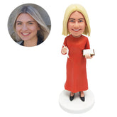 custom made bobblehead female teacher holding a book and a pen