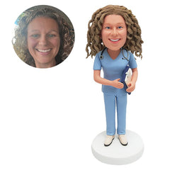 personalised bobble head figure female nurse doctor holding a noteboard