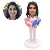 personalised bobblehead figure nurse gynecologist female doctor holding two babies