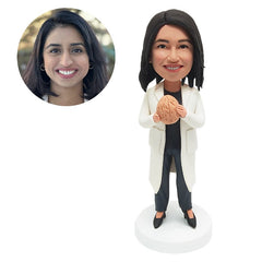 custom bobblehead figure doctor holding a brain model
