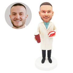 customised bobblehead figure male doctor holding a book and a drink