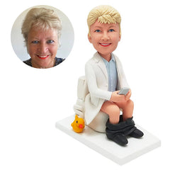 customized bobble head figure female doctor on a toilet