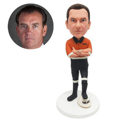 customised bobblehead construction worker with a foot on the helmet