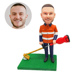 personalised bobble head figure male worker holding a weeding machine
