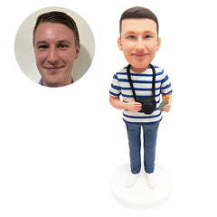customised bobble head figure man holding a camera