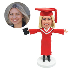 custom bobblehead figure female graduate holding a book with arms opened