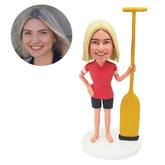 custom bobble head figure lady holding an oar