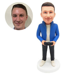 customised bobblehead figure man holding a gamepad