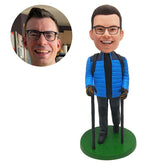 customised male climber bobblehead in blue jacket hiking with crutches