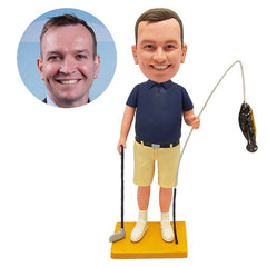 custom made bobblehead figure man holding a golf club and a fishing rod