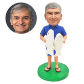 personalised fishing bobblehead figure fisherman holding a two fishes