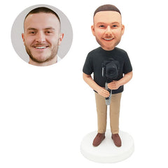 personalized bobble head figure photographer holding a camera stabilizer