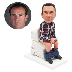 custom bobblehead shitting man on a toilet playing mobile phone
