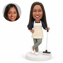 custom bobblehead figure female cleaner in an apron holding a broom