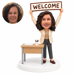 custom bobblehead figure woman standing at a desk holding a welcome sign overhead