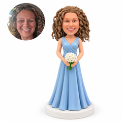 custom bobblehead figure bridesmaid in a light blue wrap gown holding flowers