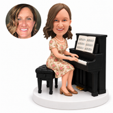 custom bobblehead figure woman in a floral dress playing an upright piano