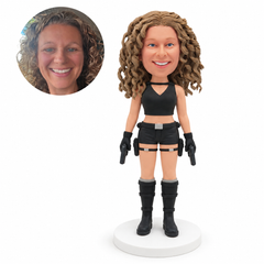 custom bobblehead figure female adventurer in shorts holding two prop pistols