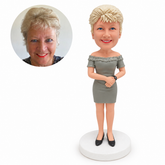 custom bobblehead figure woman in an off-shoulder dress with arms across her waist