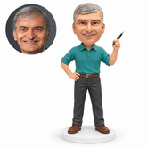 custom bobblehead figure man holding a pen near his shoulder with one hand on his hip