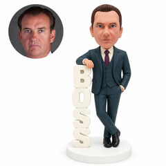 custom bobblehead figure businessman resting his arm on vertical BOSS letters