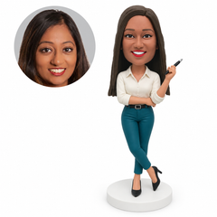 custom bobblehead figure businesswoman holding a pen with her opposite arm supporting the elbow