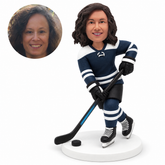 custom bobblehead figure female ice hockey player handling a stick with crossed skates