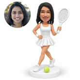 custom bobblehead figure female tennis player holding a racket high with crossed legs